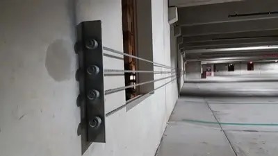 Barrier cable work in a South Florida parking structure