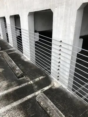 Barrier cable work in a South Florida parking structure