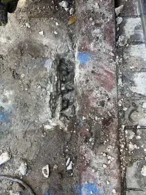 Post-tension tendon repair on a concrete slab