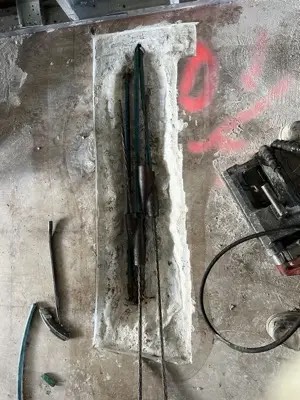 Post-tension tendon repair on a concrete slab