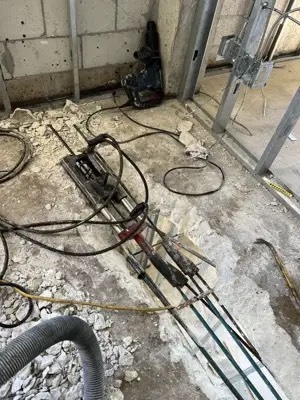 Post-tension tendon repair on a concrete slab