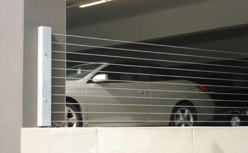 Barrier cable installation in a parking garage